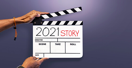 movie clip board with "2021 story" written on it.