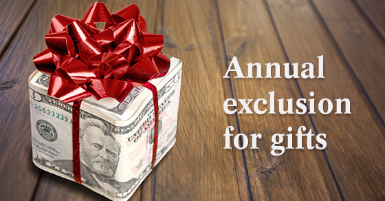 A box gift wrapped in money with a bow on top. The words "Annual Exclusion for gifts" next to the box. 