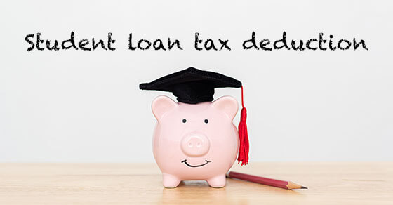 image of a piggy bank on a table, next to a pencil, with a graduation cap on. The words "Student Loan Tax Deduction" appear above the bank.