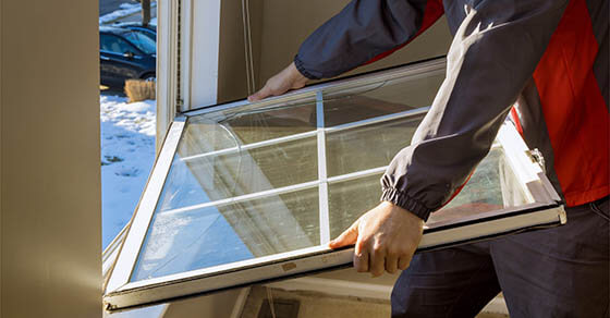 Worker in the removing break down windows in the home renovation living energy efficiency