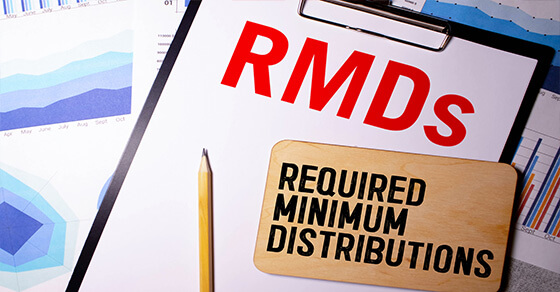 Image of a clip board and pencil with the text "RMD" along the top and "Required Minimum Distribution" below it.