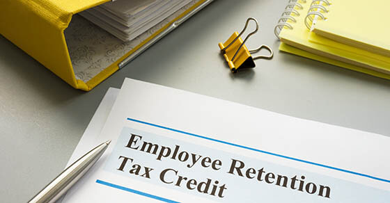Employee retention tax credit papers and folder.