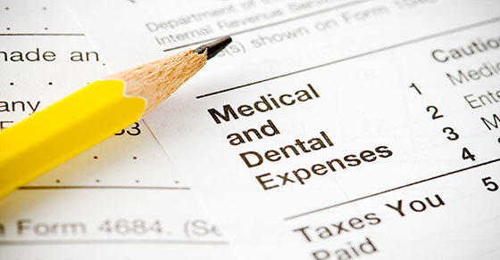 form with 'medical and detail expenses" at the top and a sharpened pencil.