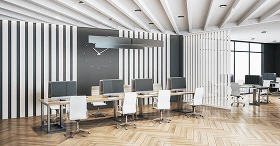 Coworking office interior withclock on the wall and computers. Workplace and lifestyle concept. 3D Rendering