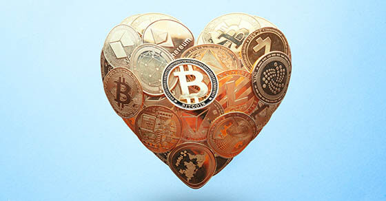 Heart shaped made with cryptocurrency coins. Happy Valentine's day symbol. Love bitcoin concept. Invest in bitcoin symbol. Donation, volunteer charity, CSR social responsibility idea.
