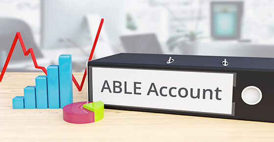 Binder on a table with the spine labeled "ABLE Accounting"