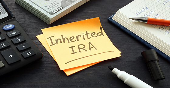 desk with a post-it that reads "Inherited IRA"