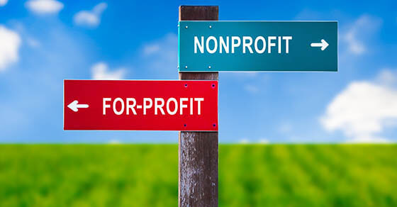 Nonprofit vs For Profit - Traffic sign with two options - subsidized unprofitable organization with no income vs entrepreneurship and business based on earning money. Charity vs capitalization