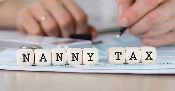 scabble tiles spelling out the words "Nanny Tax"