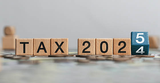 Tax 2025 concept with wooden blocks and letters. Business budget planning and investment growth in new year concept. Income tax filing and tax filing to pay tax documents online.