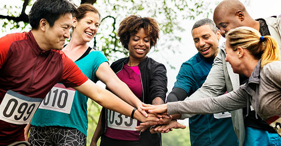 team of a diverse people getting ready for a race. 